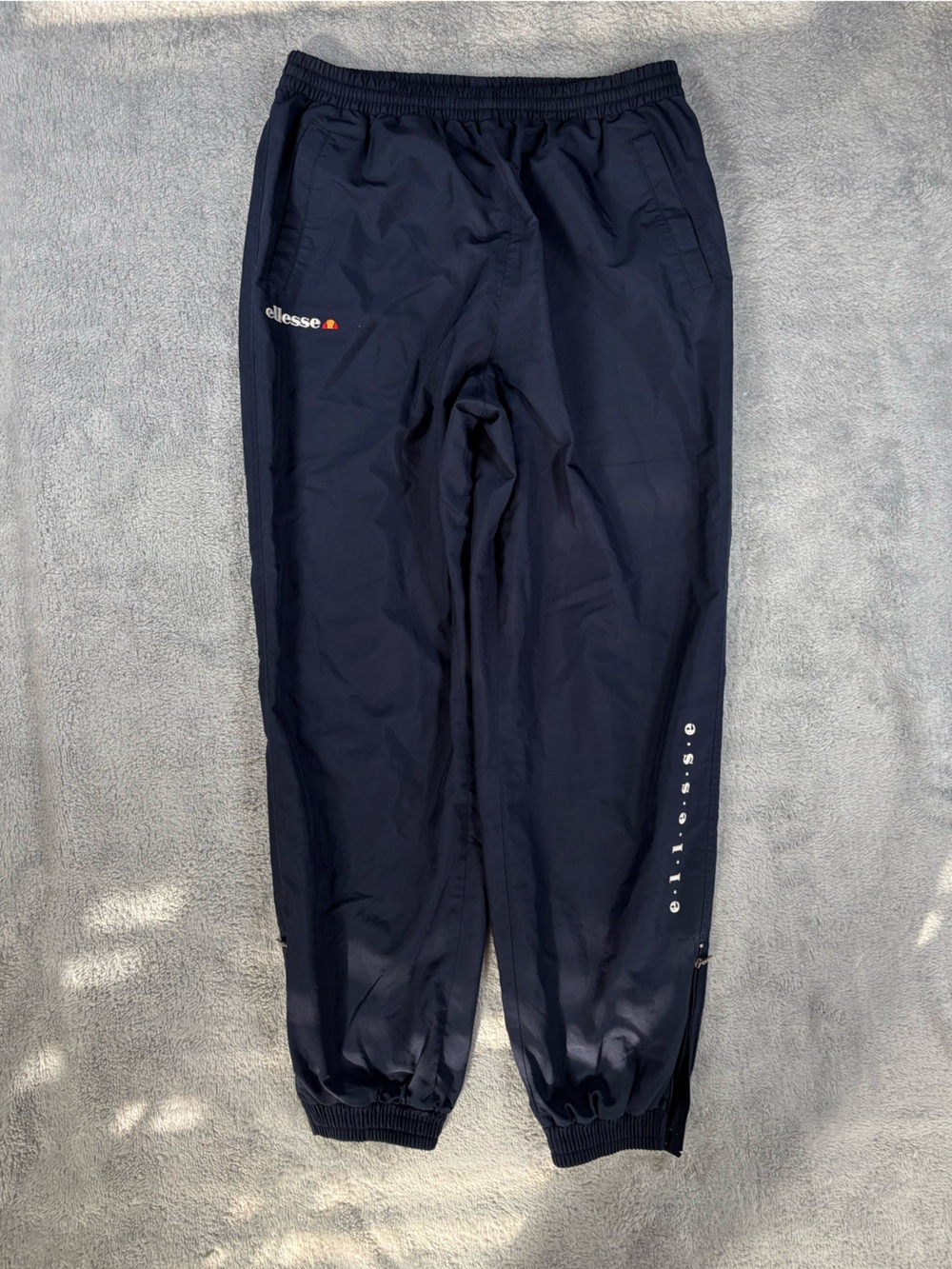 Vintage Ellesse track pants‎ with elastic  waist and cuffs.